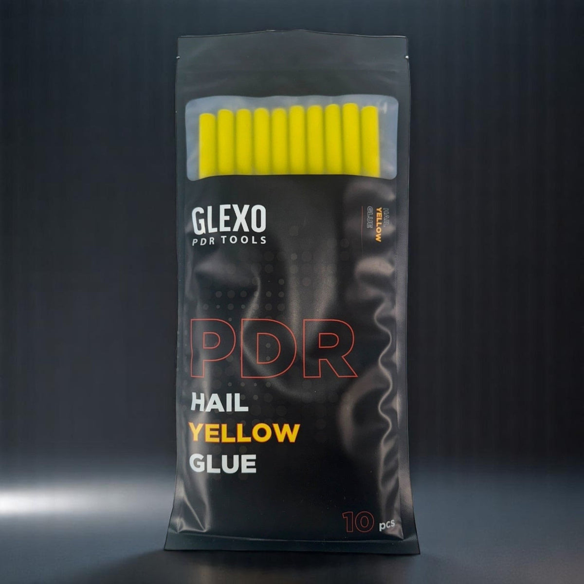 Anson PDR Glexo PDR/Hail yellow hot glue sticks in a black resealable bag, 10 pcs.