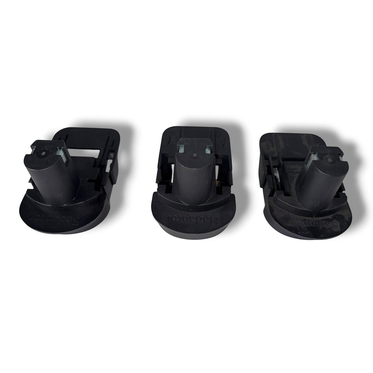 Anson PDR Trifecta adapters convert Ryobi batteries for Makita, DeWalt, and Milwaukee tools. Black plastic battery adapters.