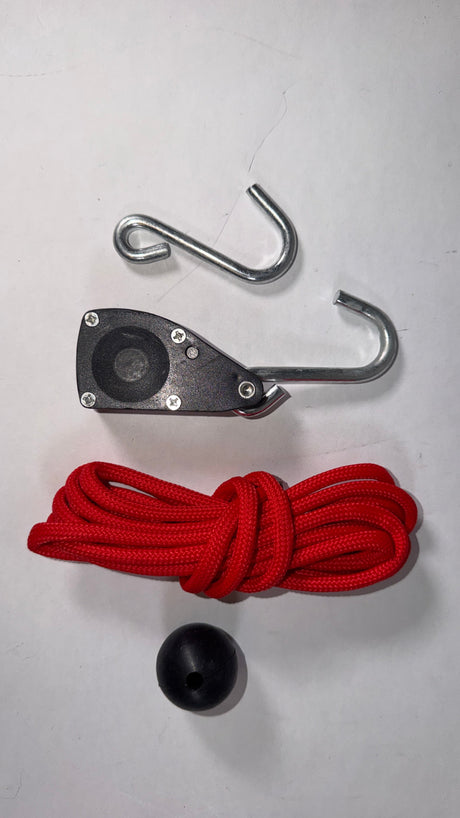 Anson PDR 1/4 inch rope ratchet with red paracord, black pulley mechanism, metal hooks, and a black stopper ball.